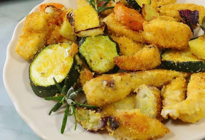 Filetti di pollo agrumati con verdure al forno